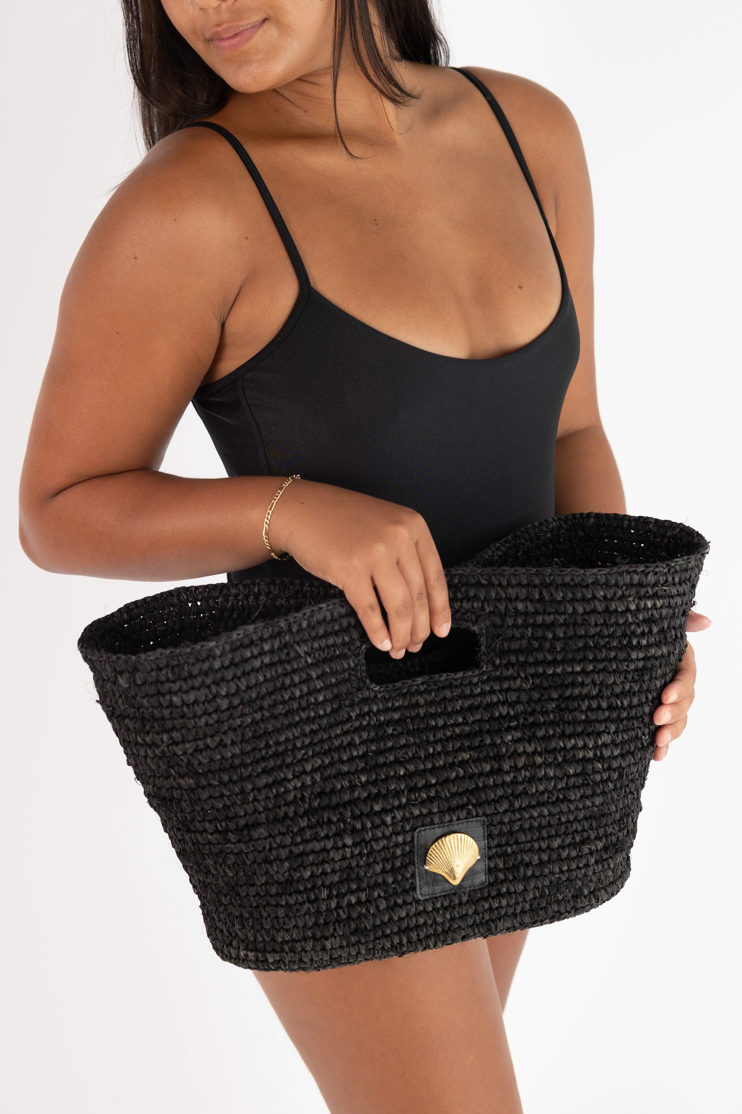 girl holding meleina bag