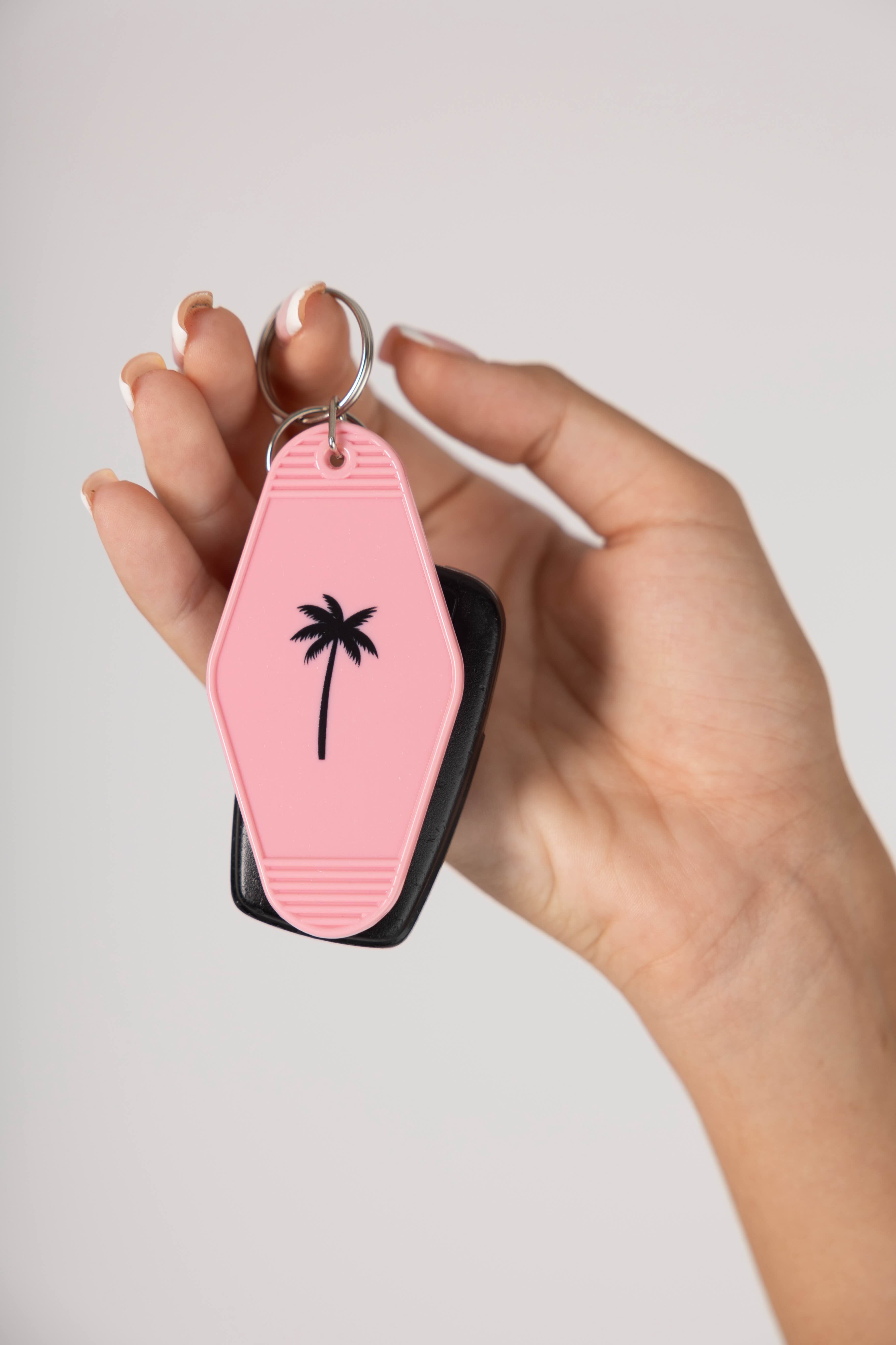 HSC keychain pink with palm tree on it